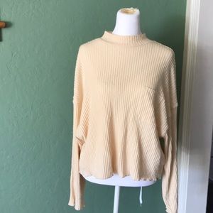 cream colored billabong turtle neck shirt